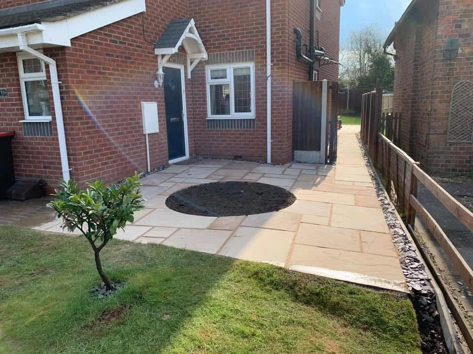 Patio connecting the rear door and side path